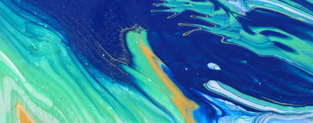 art photography of abstract marbleized effect background. Blue and gold creative colors. Beautiful paint.の写真素材