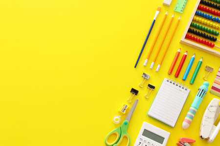 education. Back to school concept over yellow background. top view, flat lay