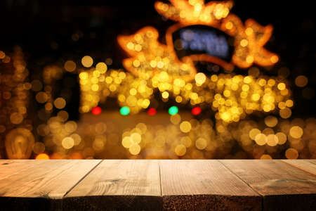 Empty table in front of christmas lights background. For product display montage