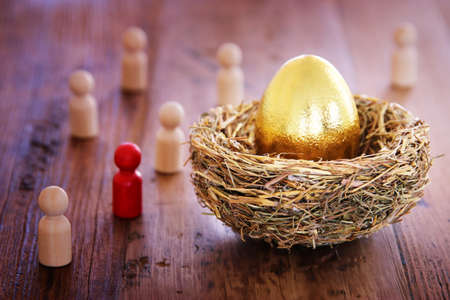 golden egg in nest. Concept of investments, savings and pensions