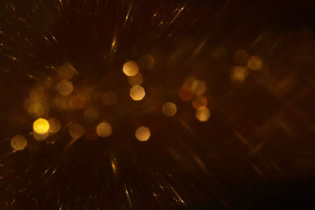 background of abstract gold and black glitter lights. defocused