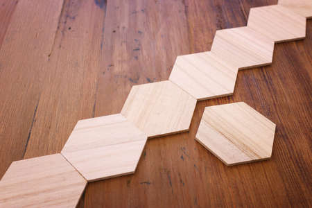 background of wooden puzzle with missing piecesの写真素材