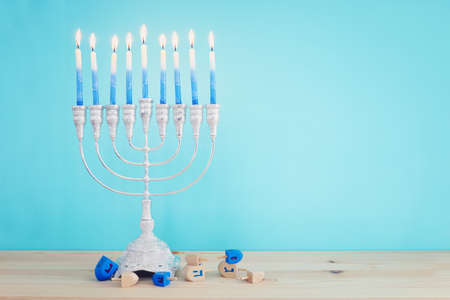 Religion image of jewish holiday Hanukkah background with menorah (traditional candelabra) and candlesの写真素材