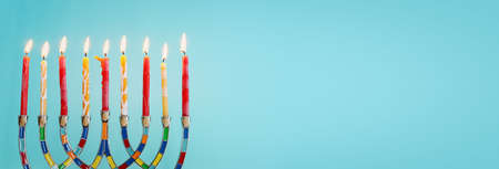 Religion image of jewish holiday Hanukkah background with menorah (traditional candelabra) and...