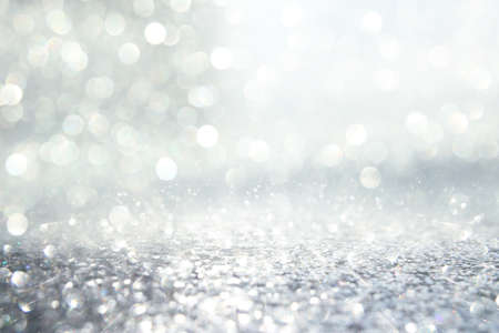 glitter vintage lights background. silver, gold and white. de-focusedの写真素材
