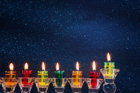 Religion image of jewish holiday Hanukkah background with menorah (traditional candelabra) and candlesの写真素材
