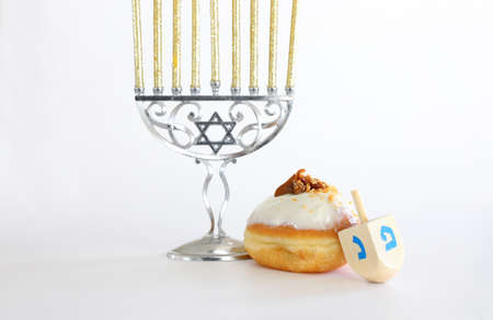 Banner of jewish holiday Hanukkah with doughnut and wooden dreidels (spinning top)の写真素材