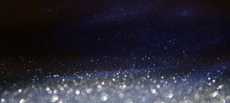 background of abstract glitter lights. Gold ,blue and black. de focused