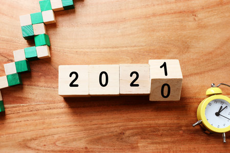 New year 2021 concept. business idea over wooden boardの写真素材