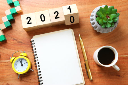 New year 2021 concept. business idea over wooden boardの写真素材