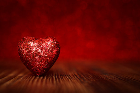 Valentine's day concept. Glitter red hearts over shiny backgroundの写真素材