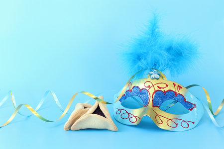 Purim celebration concept (jewish carnival holiday) over pastel blue backgroundの写真素材