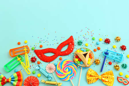 Purim celebration concept (jewish carnival holiday) over blue background. Top view, flat layの写真素材