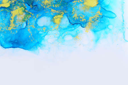 art photography of abstract fluid art painting with alcohol ink, blue and gold colorsの写真素材