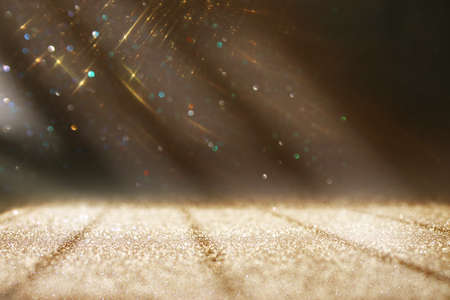 background of abstract gold and silver glitter lights. defocused