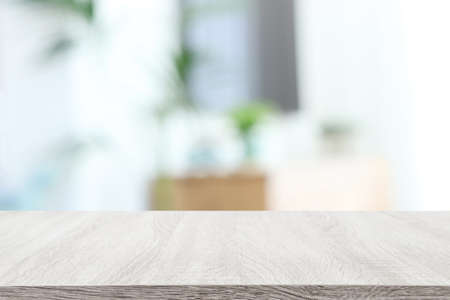 Wooden empty table in front of Living room sofa interior. For product display and presentationの写真素材