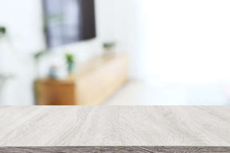 Wooden empty table in front of Living room interior. For product display and presentation