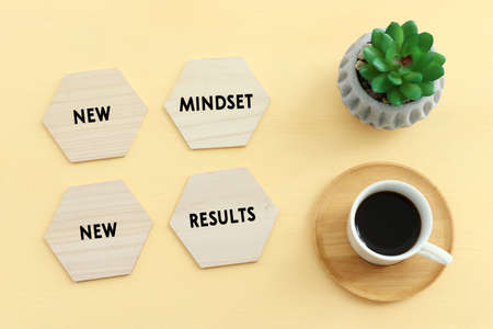concept image with new mindset new results text. top view of office tableの写真素材
