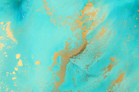 art photography of abstract fluid art painting with alcohol ink, blue, turquoise and gold colorsの写真素材