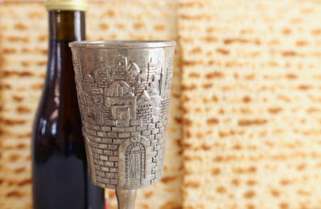 Passover background. Old Wine cup and matzoh (jewish holiday bread)の写真素材