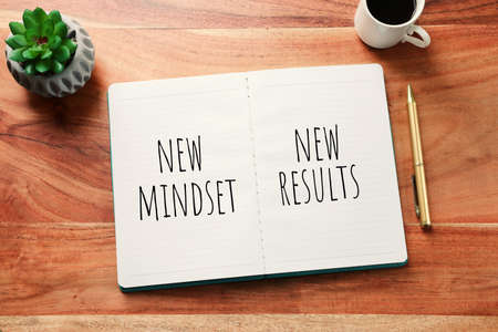 concept image with new mindset new results text. top view of office tableの写真素材