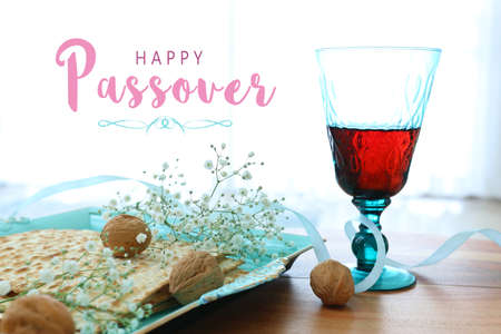 Passover background. Glass Wine cup and matzoh (jewish holiday bread)の写真素材
