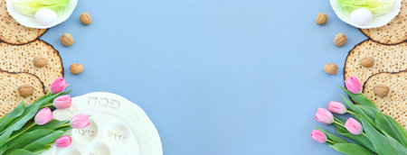 Pesah celebration concept (jewish Passover holiday). Traditional pesah plate text in hebrew:...