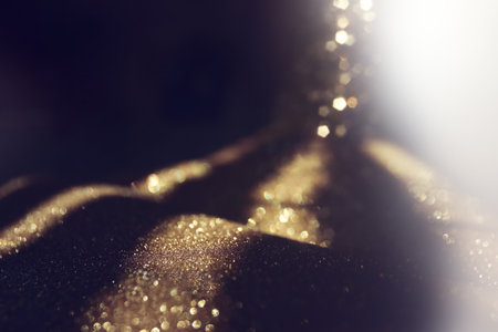 background of abstract gold and black glitter lights. defocusedの写真素材