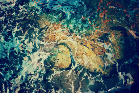 abstract background of waves of water creating swirls and ripplesの写真素材