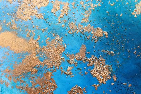 art photography of abstract fluid art painting with alcohol ink, blue and gold colors