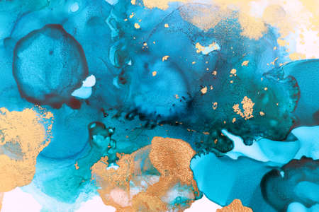 art photography of abstract fluid art painting with alcohol ink, blue and gold colorsの写真素材