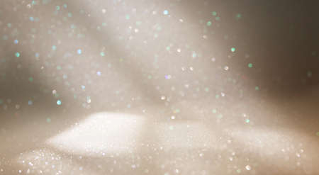 background of abstract gold and silver glitter lights. defocused