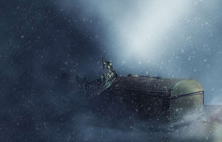 low key image of beautiful queen or king crown over gold treasure chest. vintage filtered. fantasy...