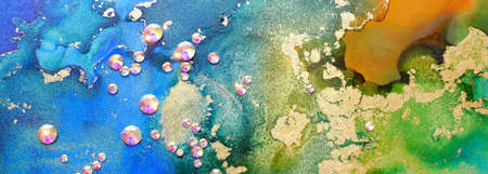 art photography of abstract fluid art painting with alcohol ink blue, green, gold colors and crystal...