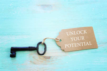 unlock your potential concept. vintage key with tagの写真素材