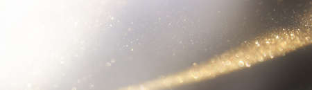 background of abstract gold and black glitter lights. defocused