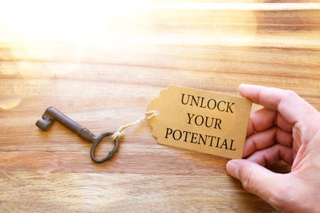 unlock your potential concept. vintage key with tagの写真素材