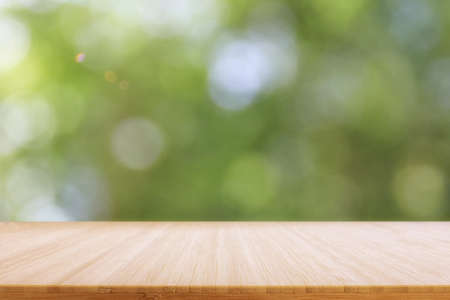 Empty rustic table in front of countryside background. product display and picnic conceptの写真素材