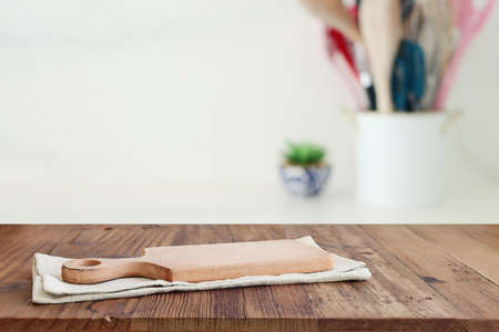 empty table board and defocused modern kitchen background. product display conceptの写真素材