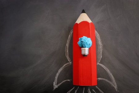 Education concept image. Creative idea and innovation. Crumpled paper as light bulb metaphor and...
