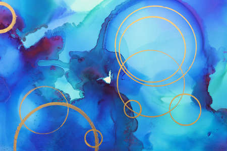 art photography of abstract fluid painting with alcohol ink, blue and gold colorsの写真素材