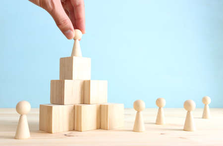 business concept image of people figures over wooden blocks and table, human resources and management conceptの写真素材