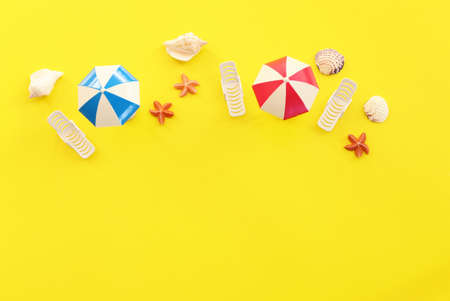 holidays top view image of tropical beach with chairs under umbrellas. Summer travel and vacation...