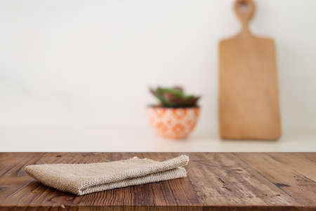 empty table board and defocused modern kitchen background. product display conceptの写真素材