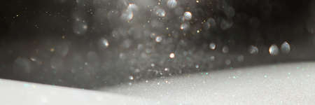 background of abstract silver, gold and black glitter lights. defocusedの写真素材