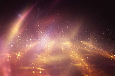 background of abstract gold and red glitter lights. defocusedの写真素材