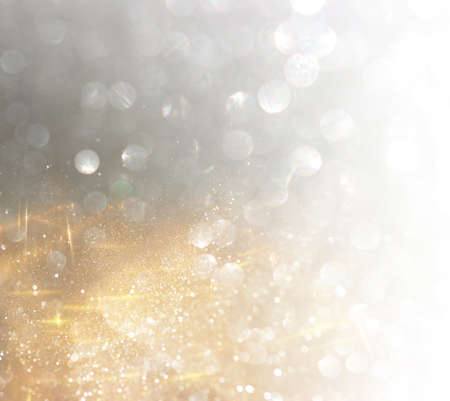 abstract glitter silver and gild lights background. de-focused