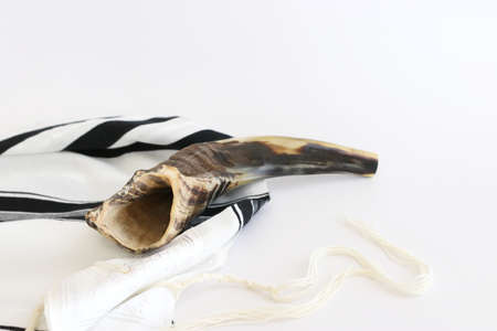 religion image of shofar (horn) on white prayer talit. Rosh hashanah (jewish New Year holiday), Shabbat and Yom kippur conceptの写真素材
