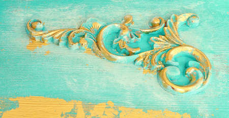background of blue and gold wooden vintage wall with floral emboss details