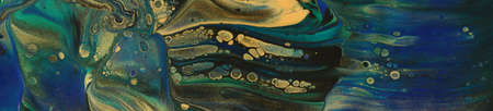 art photography of abstract marbleized effect background. Black, gold, blue and green creative...